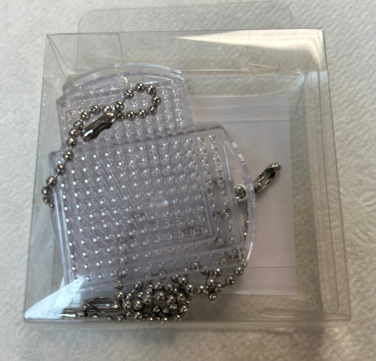 4 Transparent Pixel Keychain Medallions with Chain - 22062-4
